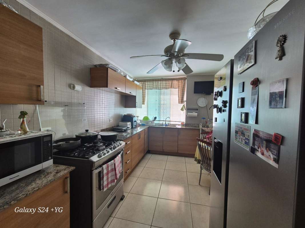 Master bedroom with large window, tile floors, ensuite bathroom PH 7400 San Francisco Panama