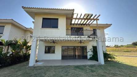 Two-story cream colored home with pergola balcony in San Jose Beach Club Panama