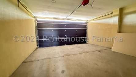 Modern living room with sliding glass doors and patio view in San Carlos Panama