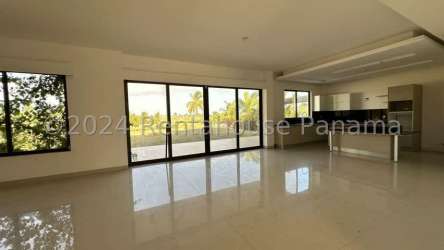 Spacious open kitchen and lounge area with windows in San Jose Beach Club Panama