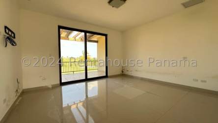 Empty bedroom with tile floors and large windows in San Jose Beach Club San Carlos
