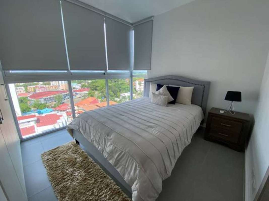 Second bedroom with built-in closet and AC unit in PH Signature Point Bella Vista Panama