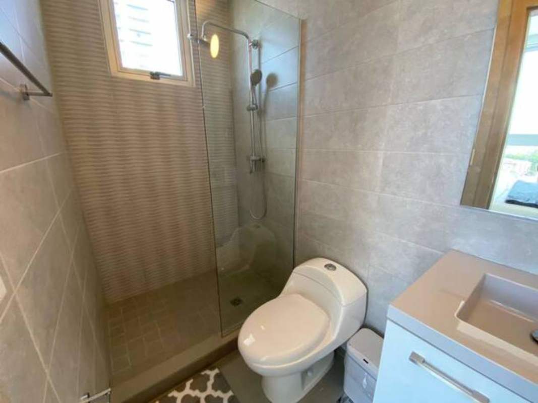 Bathroom with walk-in glass shower and modern fixtures PH Signature Point Panama