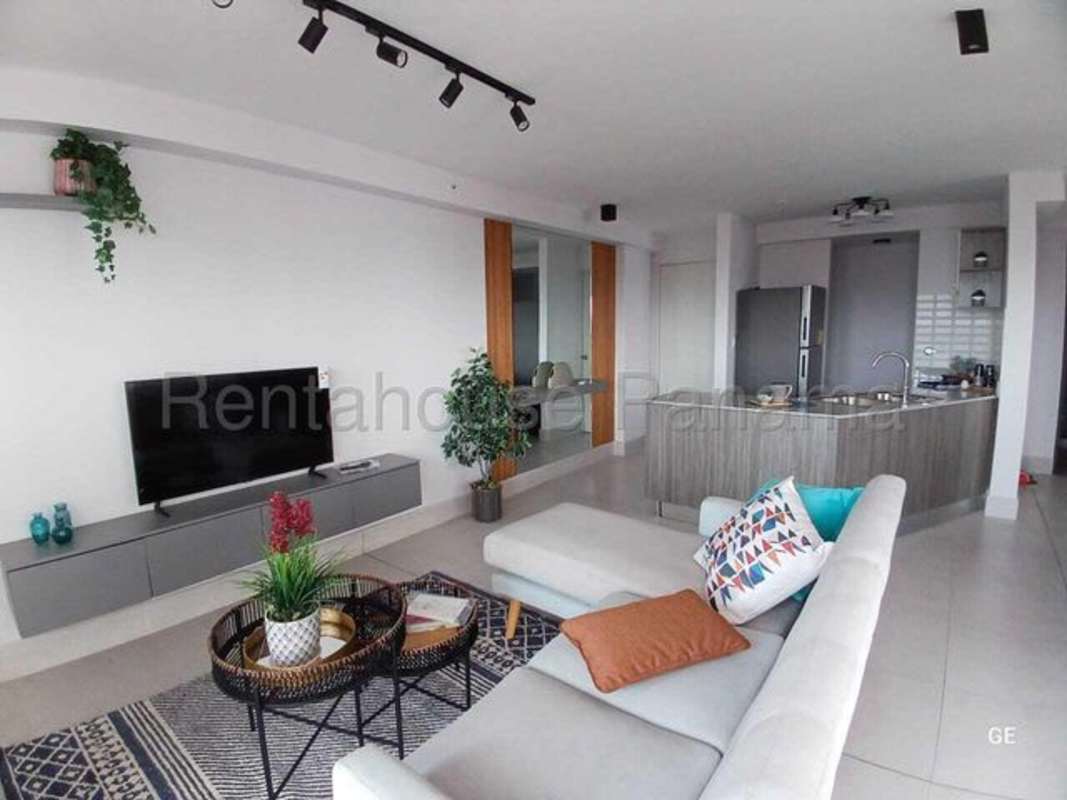 Modern kitchen with island and dining area with city views PH Park Oasis Panama