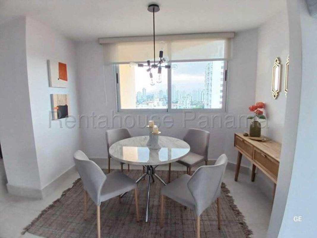 Dining space with marble top table large window skyline view PH Park Oasis Panama