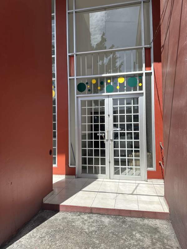Modern commercial glass door entrance Mystic Park Plaza Juan Díaz Panama