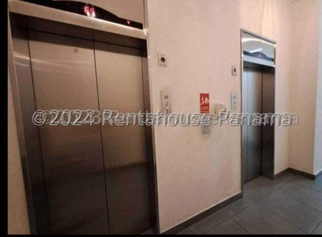 Modern lobby with elevators in Carrasquilla Plaza condominium Panama City