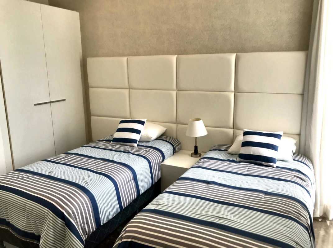 Luxury master bedroom featuring ocean views, king bed, elegant décor PH Yoo Panama City