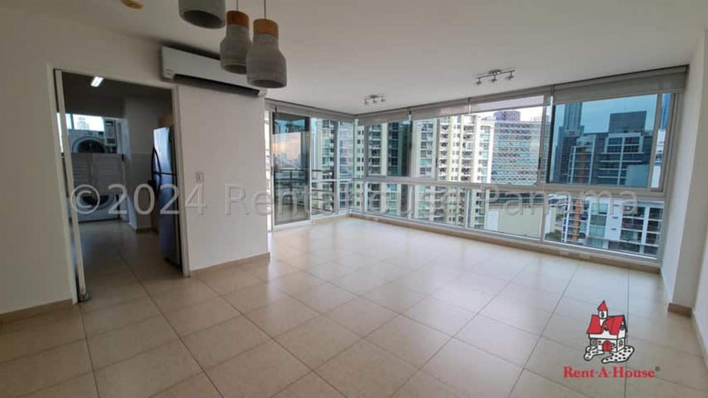 Modern living room with city views and floor-to-ceiling glass in PH Costa del Este Panama