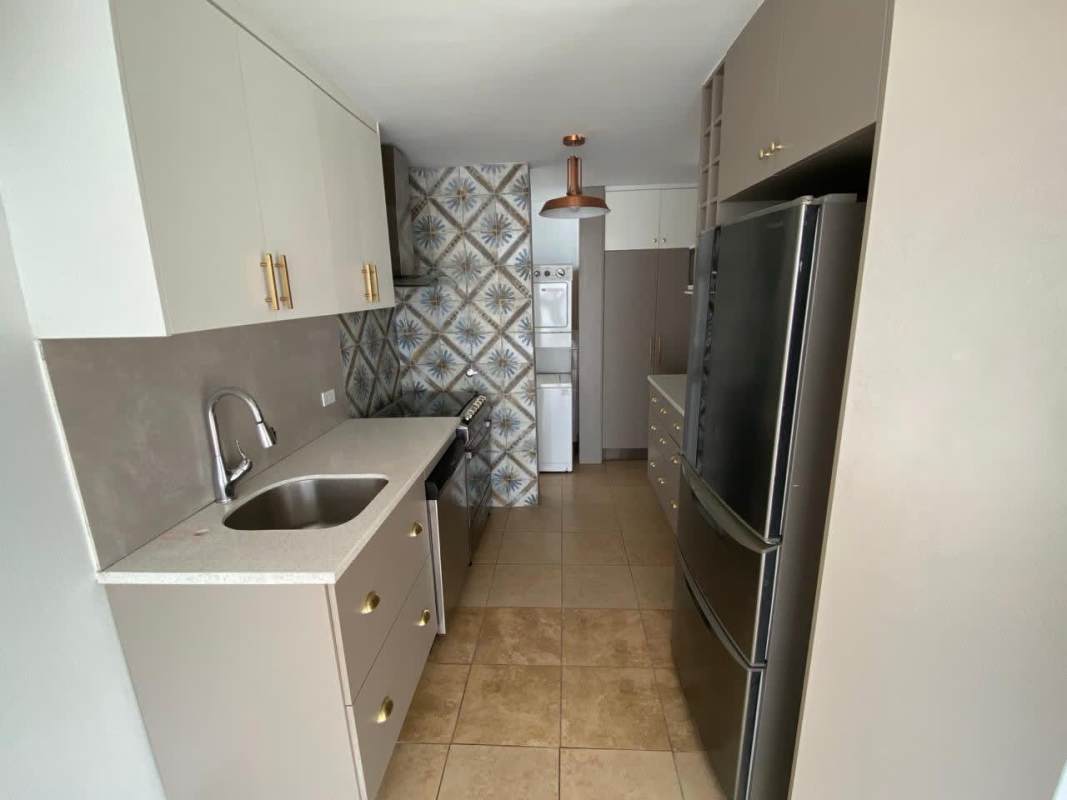 Open living dining space with large windows, ceiling fans, tile floors, and city views at PH Cosmopolitan Transístmica