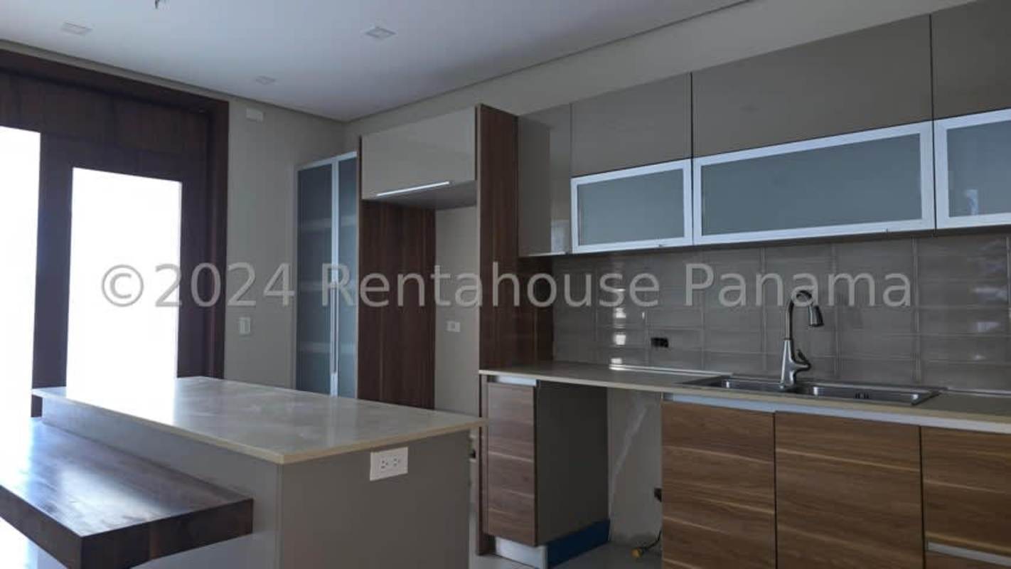 Contemporary kitchen with island countertop in PH Marina Mar Marbella Panama