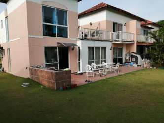 Balcony terrace with hammock overlooking golf course greenery in Decameron Beach Panama