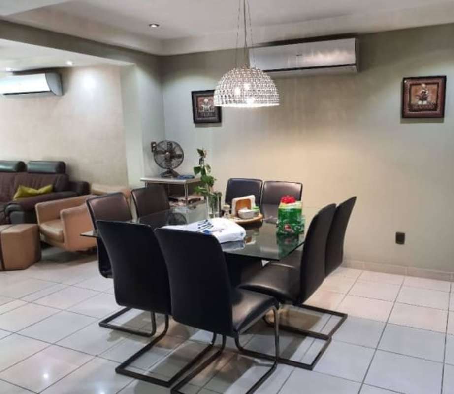 Modern main bathroom double sink wooden vanity tile floors Clayton luxury home Panama