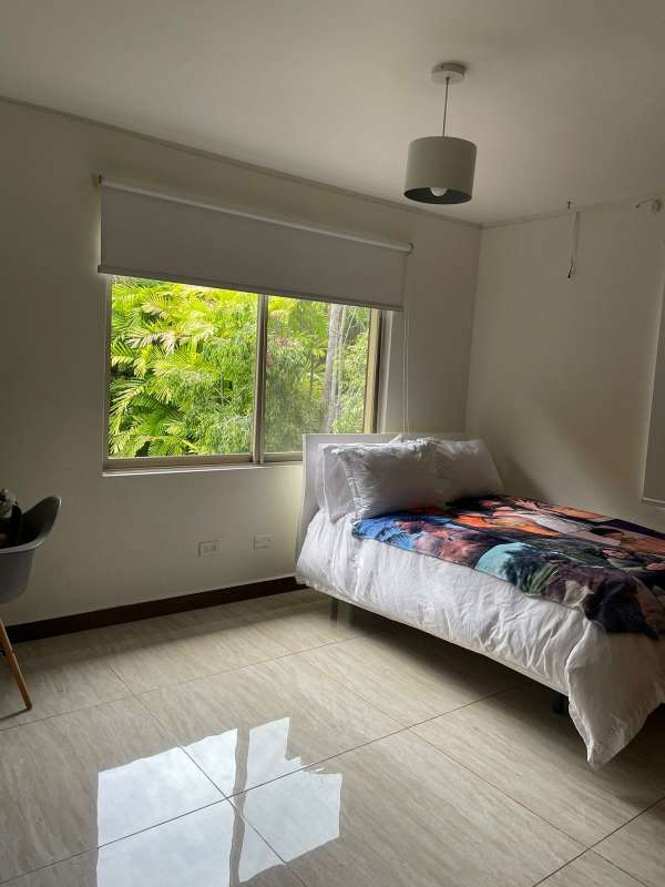 Spacious bedroom with tile flooring and natural light Clayton Panama