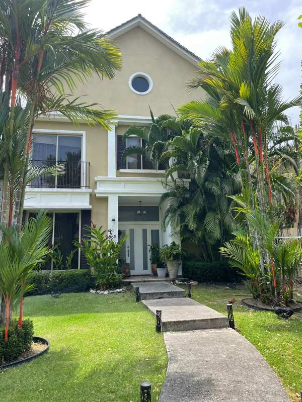 Contemporary kitchen with wood cabinetry, granite countertops, stainless steel appliances Embassy Gardens Clayton Panama