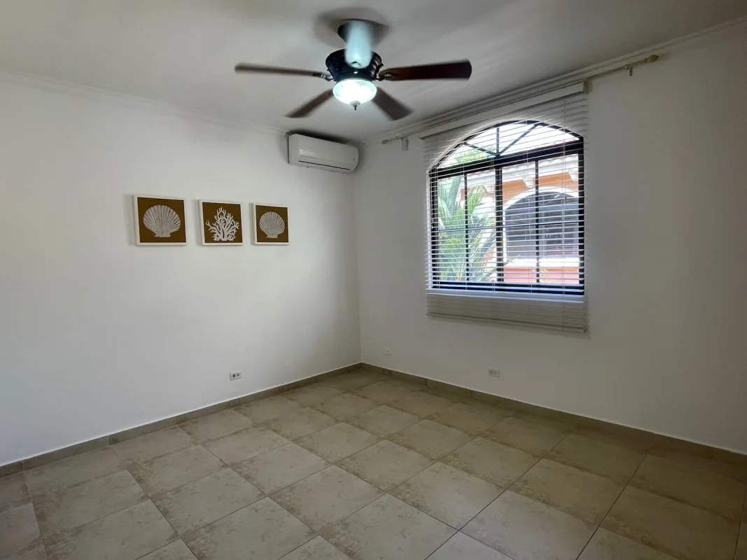 Private pool with jacuzzi, lush tropical landscaping, and covered patio area in PH Clayton Village Panama