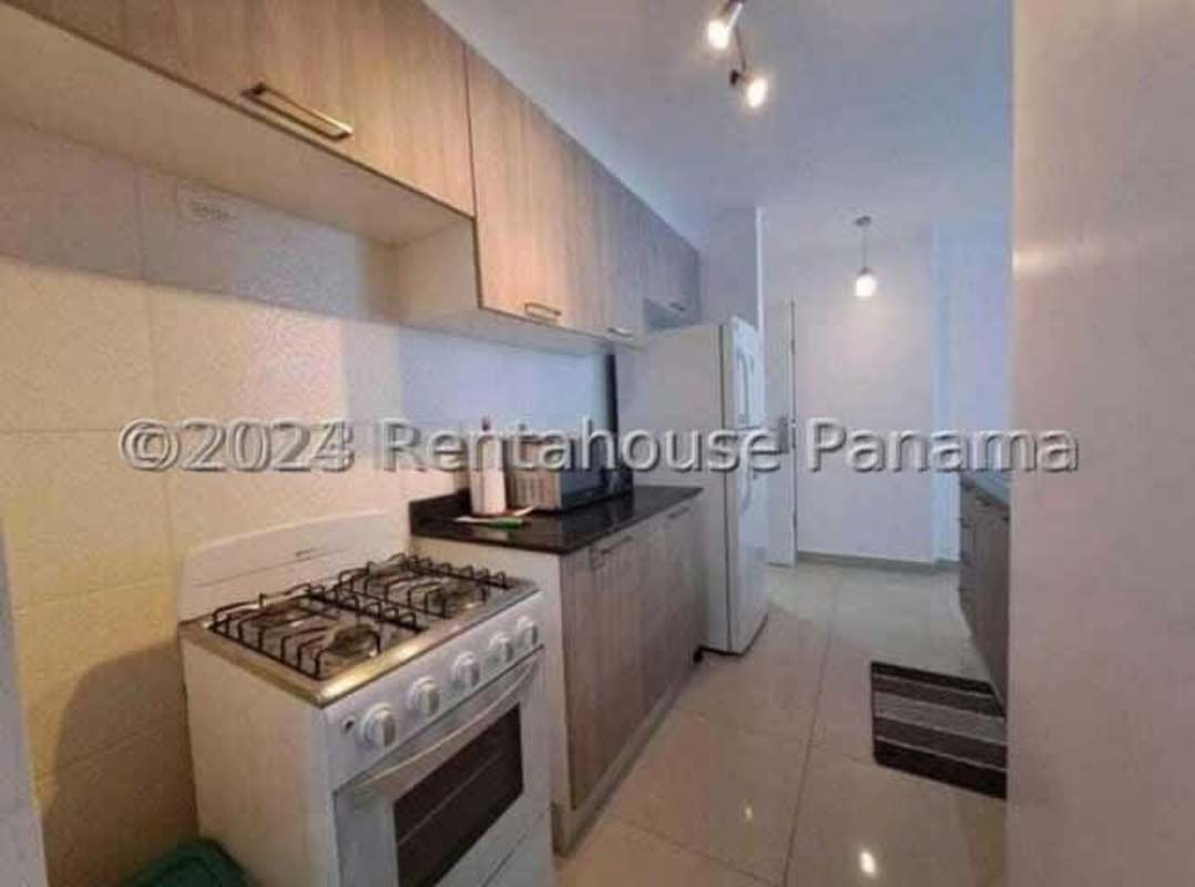 Living and dining open space with large windows and balcony access in PH Coral Towers Carrasquilla Panama