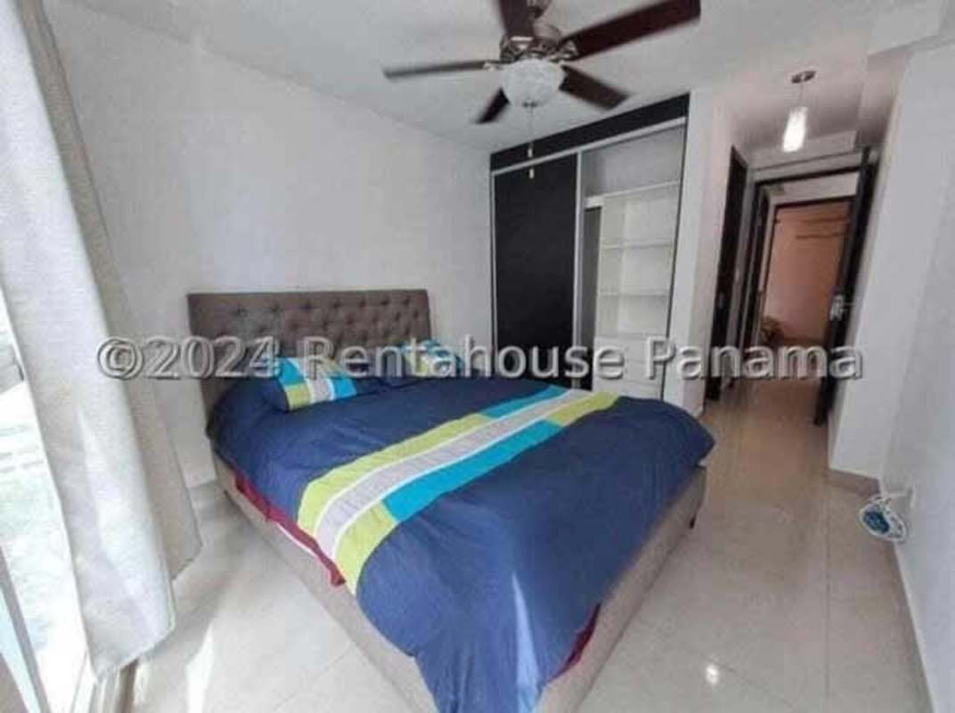 Bedroom with closet and light fixture in PH Coral Towers Carrasquilla Panama City