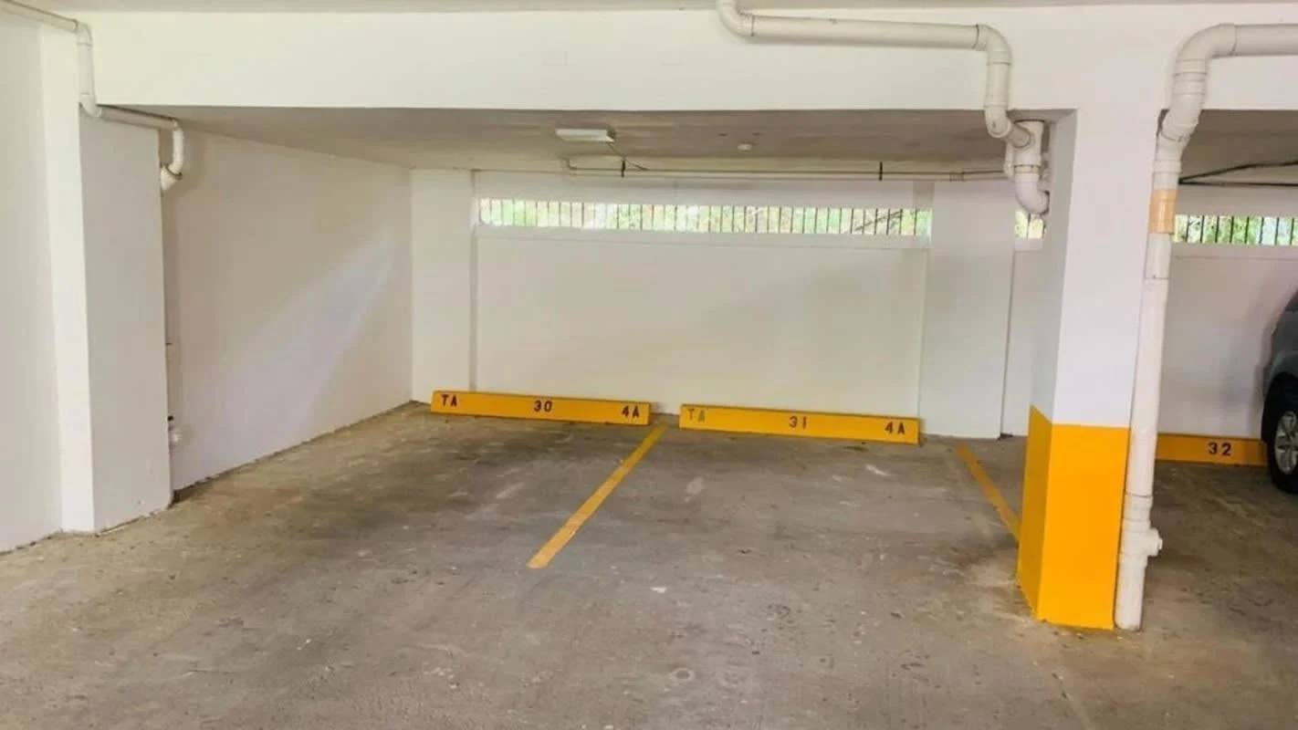 Covered parking area with marked spots at PH Canal View Albrook Panama City