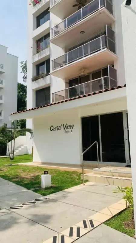 Exterior of PH Canal View apartment complex with balconies and tropical landscaping in Clayton Panama City