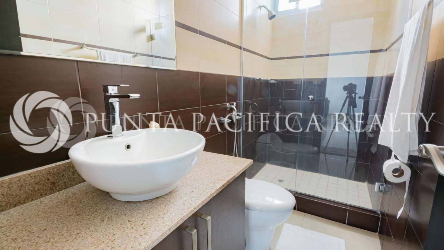 Contemporary bathroom featuring vessel sink, granite countertop, glass shower in PH Pacific Sky Punta Pacífica