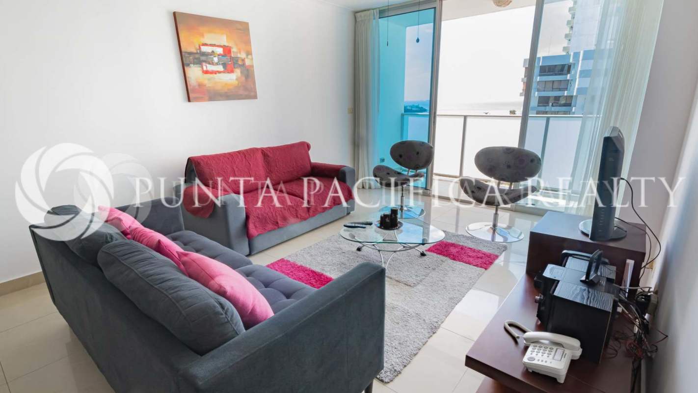 Open dining and lounge with large windows, split AC, view towards Punta Pacífica skyline