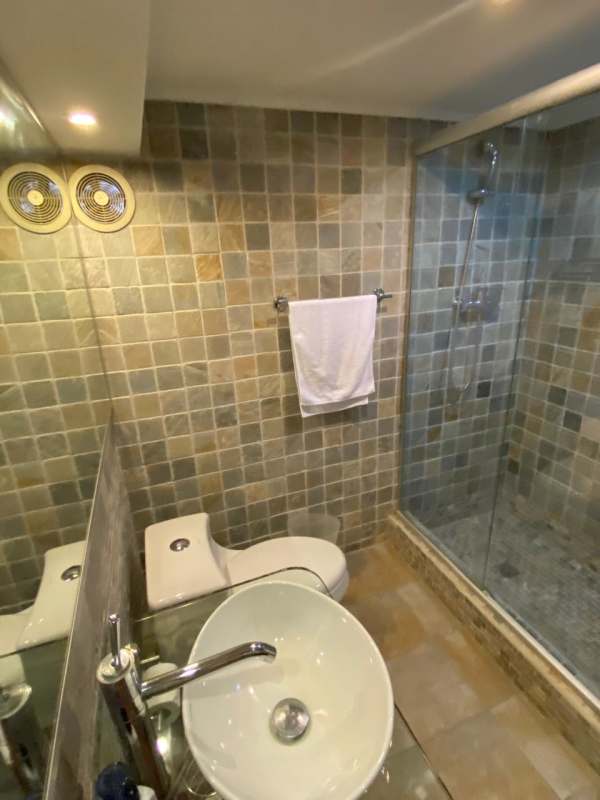 Open living room with garden views renovated luxury house in Clayton Village Panama for sale