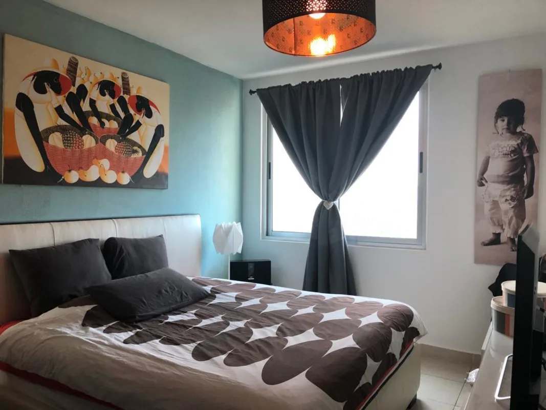 Bedroom with blue accent wall, window, modern decor PH Clayton Park Panama