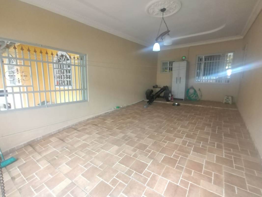 Garage interior space with tile flooring at Villa Zaita house