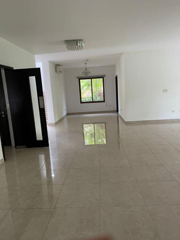 Bright open living and dining room with garden views in rental house Clayton Panama
