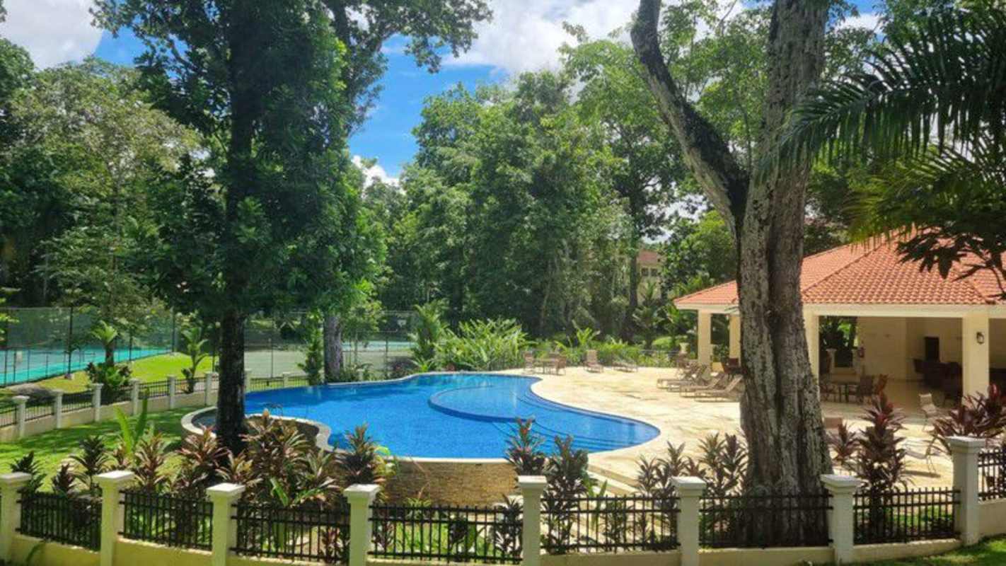 Luxury residential pool with sun deck, landscaped gardens in Clayton Panama