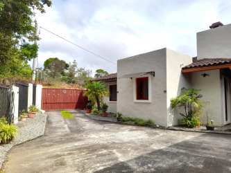 Mediterranean-style home with gated driveway, clay tiles and landscaping Santa Lucia Boquete