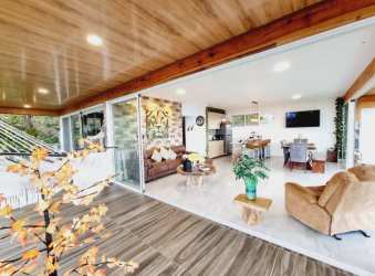 Open living dining cabin interior with large windows Altos del María Panama