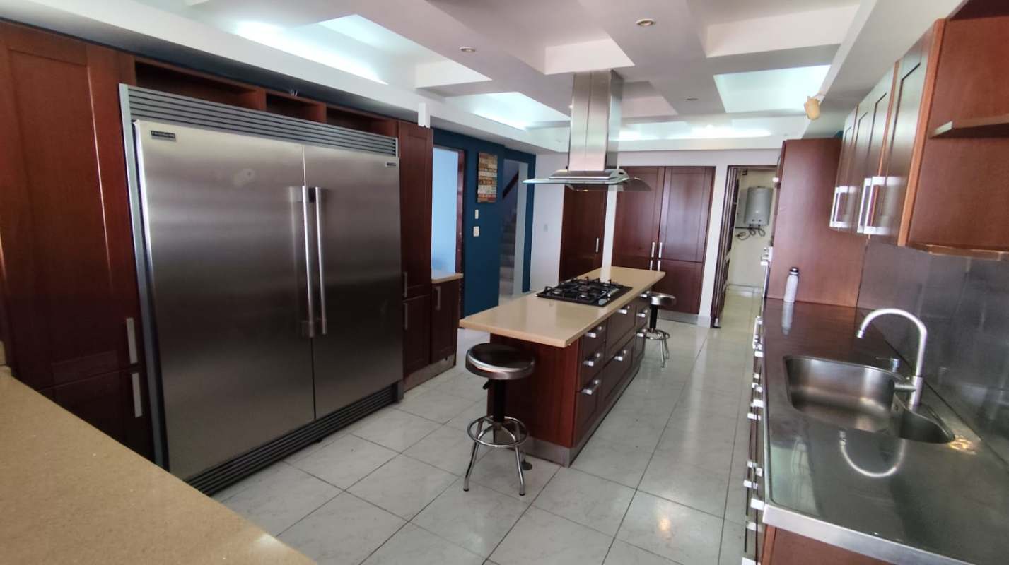 Spacious modern kitchen with island, stainless appliances, window views Betania Panama