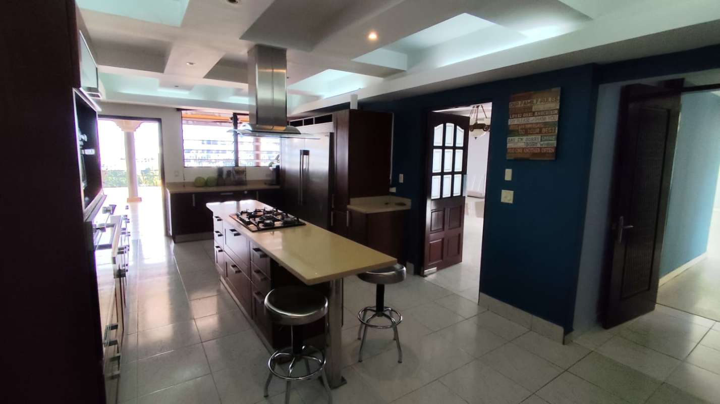 Large bedroom with city view windows wooden ceiling AC Betania Panama