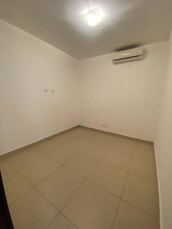 Modern kitchen with granite counters, wood cabinets, stainless appliances PH Rivage Panama