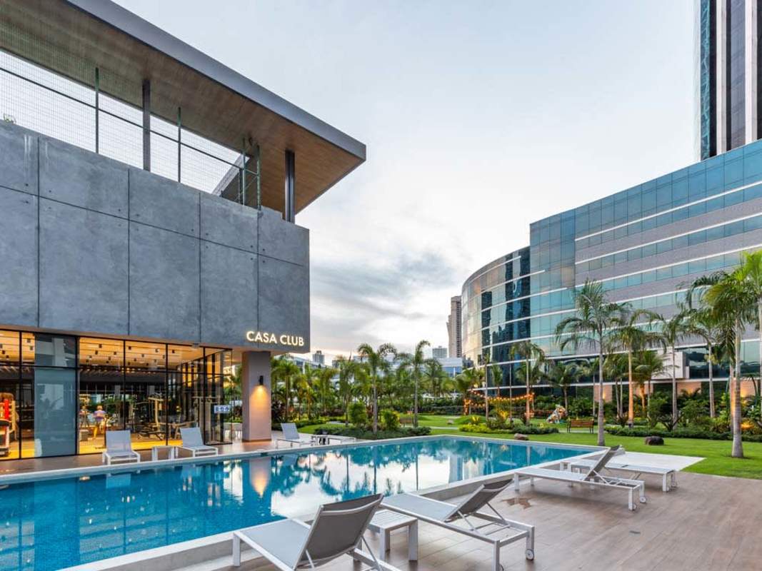 Modern residential towers with pool, gardens and city skyline PH Country Club Costa del Este Panama