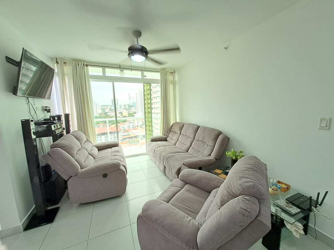 Living room with balcony, large windows, city view in PH Carrasquilla Tower Panama
