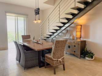 Modern kitchen with granite counters, island and stainless steel appliances in PH Puntarena