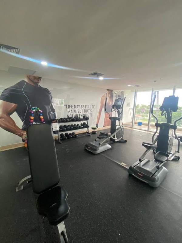 Modern living-dining area overlooking ocean and skyline, PH Rivage Panama City