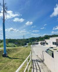 Spacious empty commercial room with gray tile floor and white walls inside Mystic City La Chorrera Panama