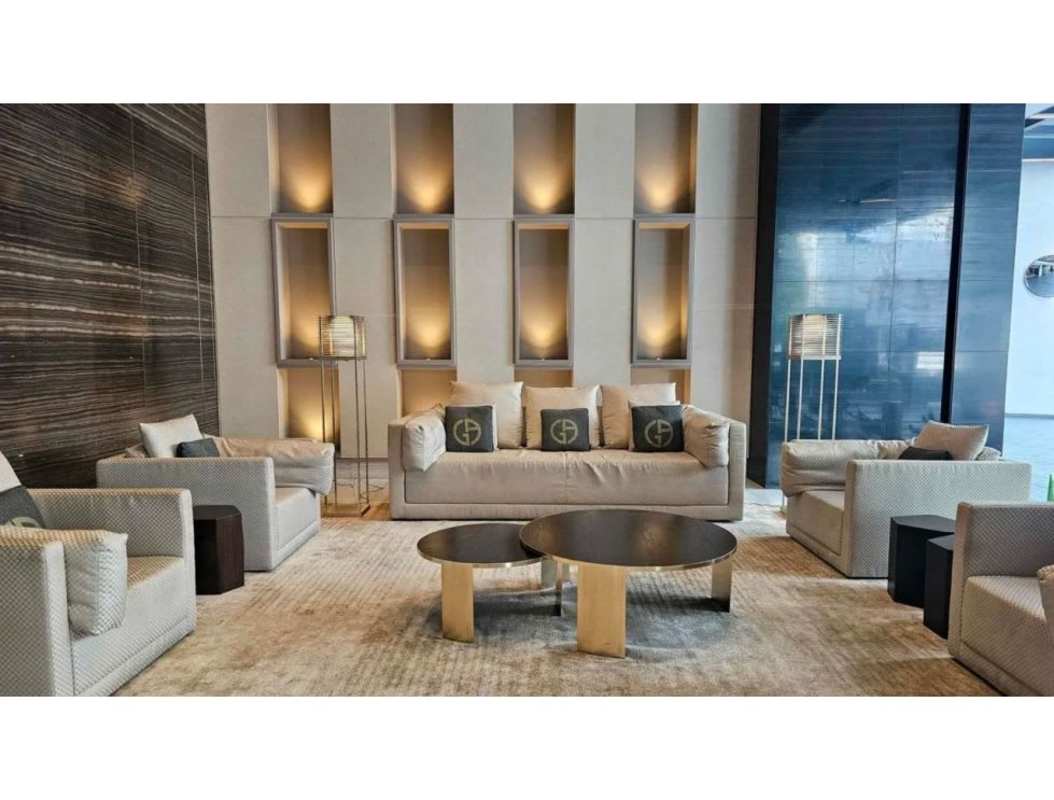 Contemporary gym with large windows, city views, and modern equipment in Nuovo by Armani Casa Panama