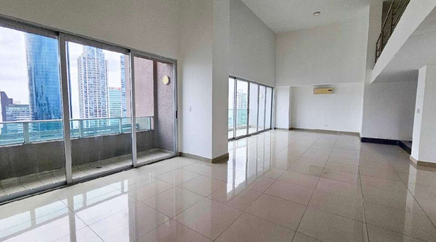 Balcony view showcasing Panama City skyline and Pacific Ocean from loft apartment in Costa del Este