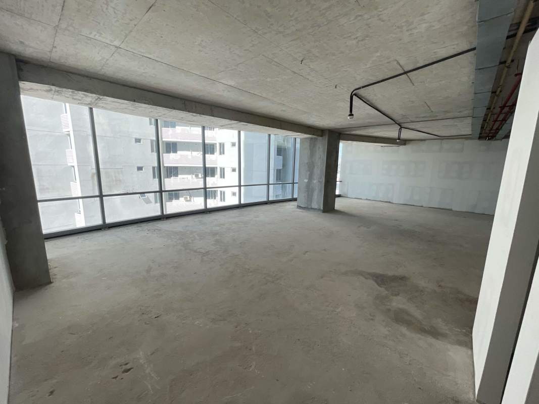 Spacious corporate lobby with glass walls, escalator, marble floors Financial Park Panama