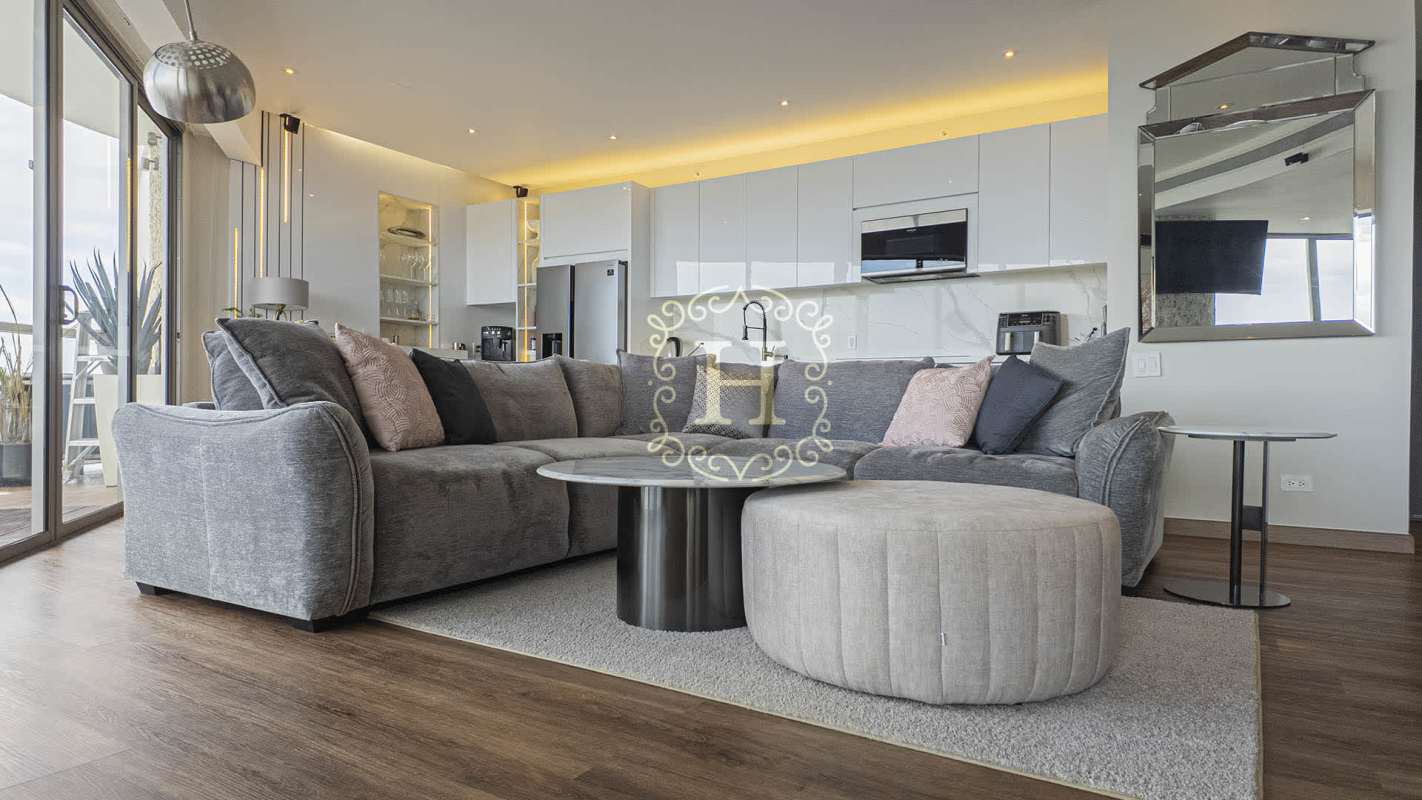 Modern bathroom with marble double vanity and glass shower in luxury suite The Ocean Club Panama
