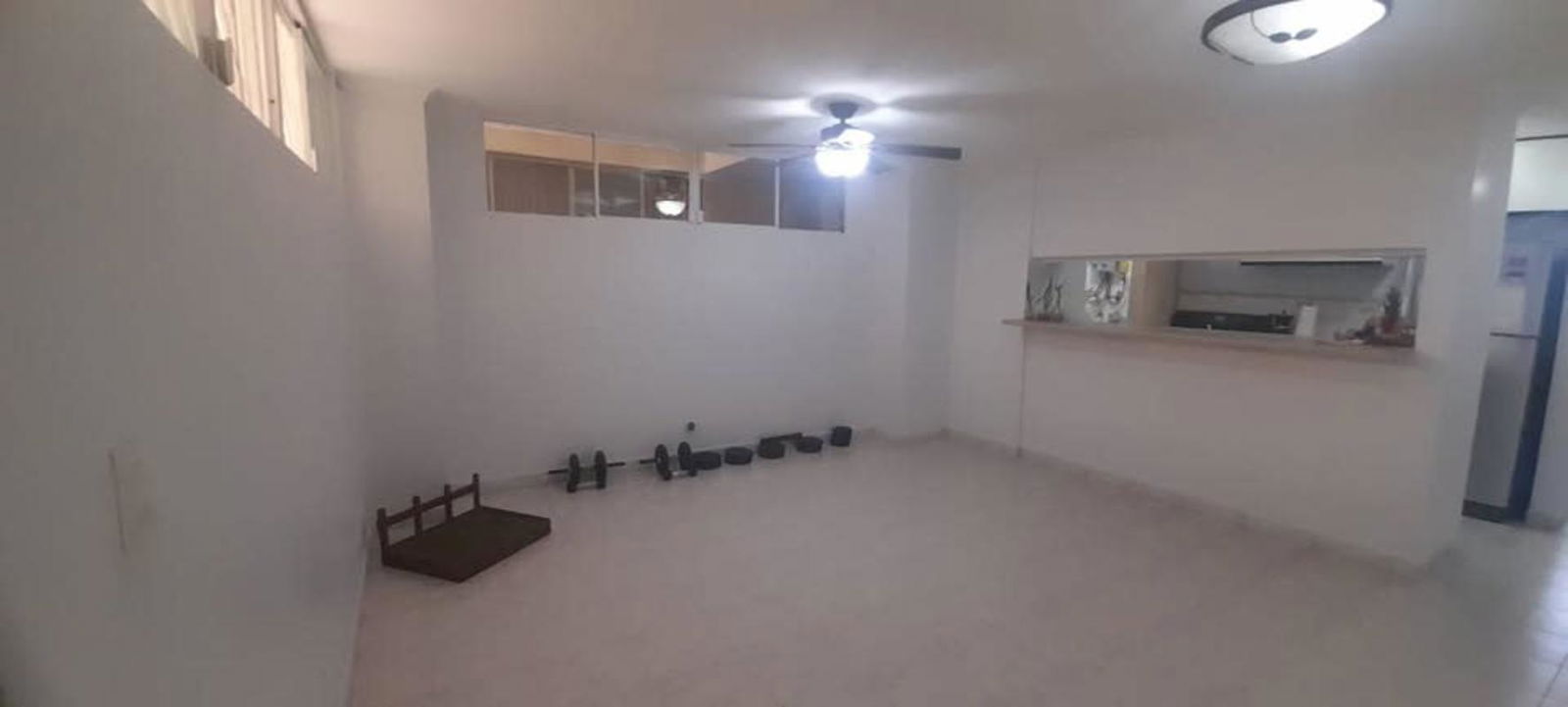 Interior atrium courtyard with fountain, benches, tiled floor in Parque Lefevre apartment complex