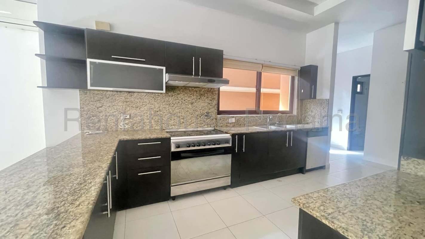 Dining area with large windows overlooking tropical garden Costa Sur Panama