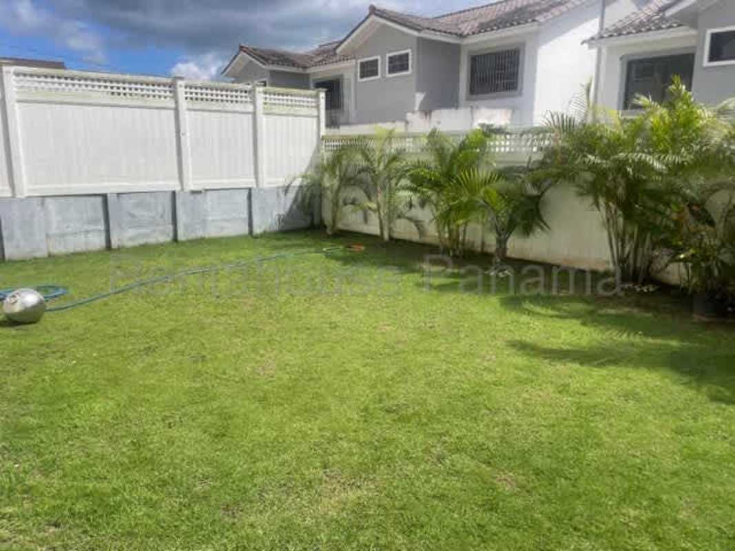 Spacious open living and dining room with large window in rental house Panama