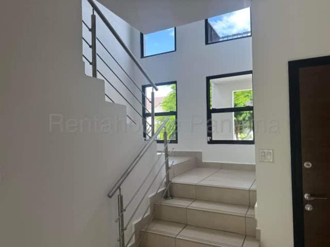 Covered terrace with tile floor and view to private backyard Sierra Nevada Panama