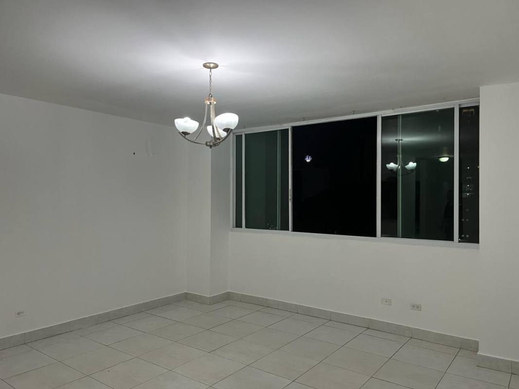 Living room tiled floors chandelier window with city skyline Edison Park Panama